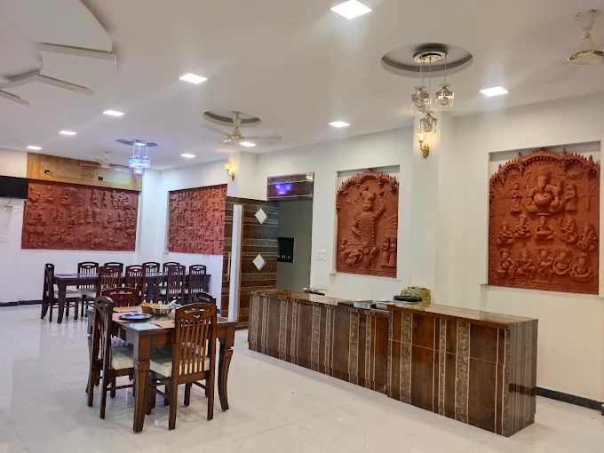 Reception and dining area with terracotta wall art